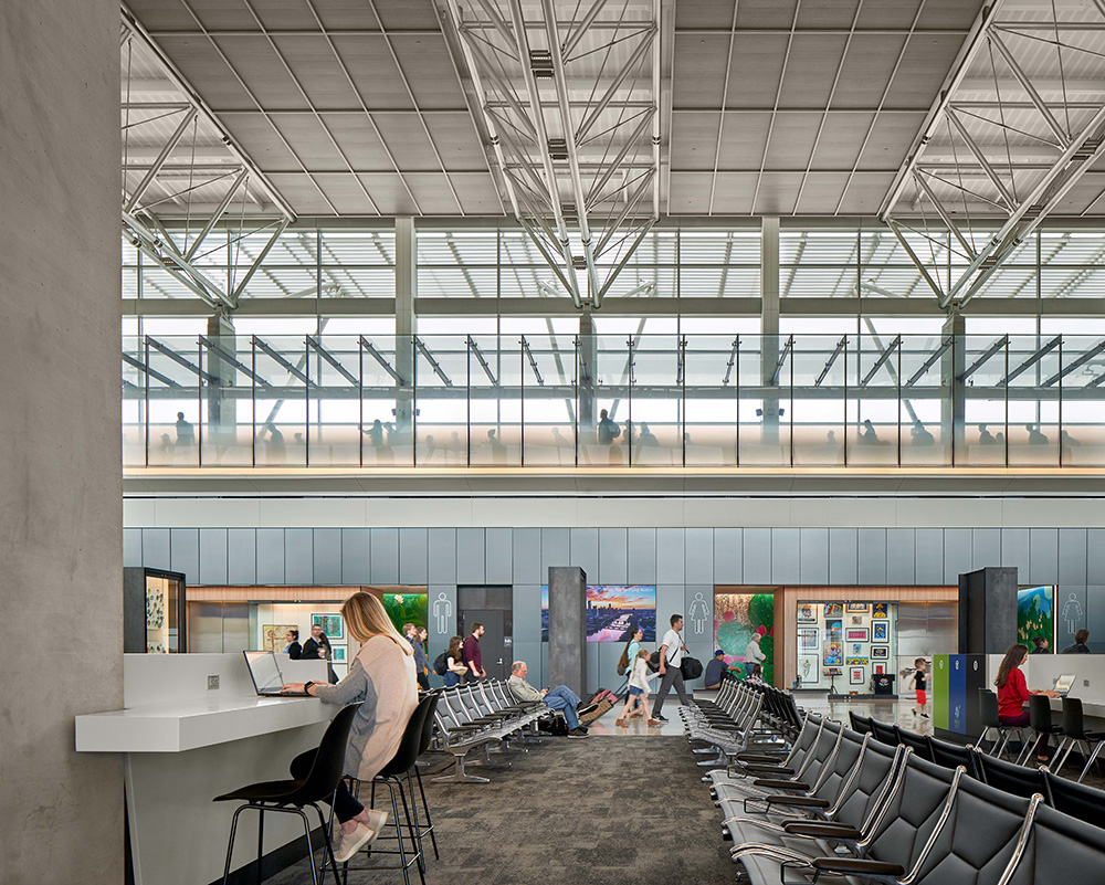 airport gate with seating, computer work area