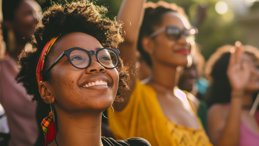 Black women smiling at festival