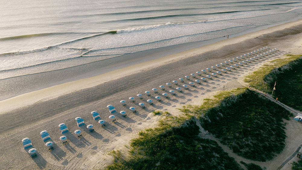 beach with umbrellas and chairs