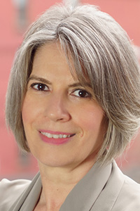 smiling woman with greying hair