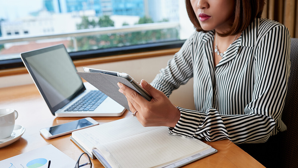 woman at desk working on budget